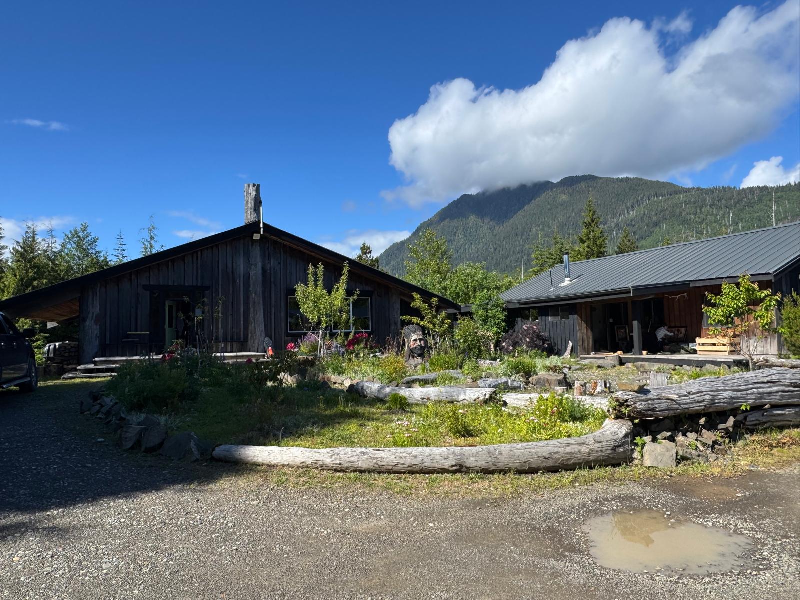 The station nestled below the peak, with the trail rising behind