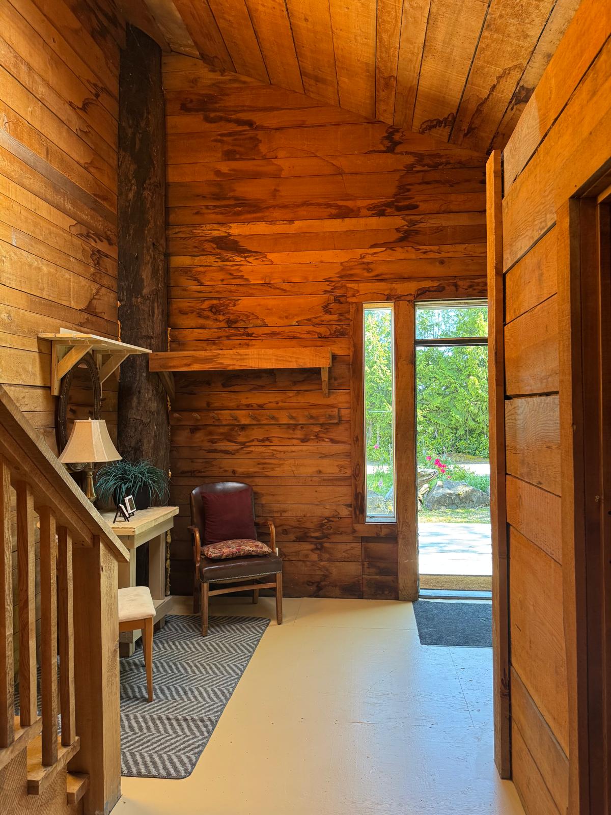 Handcrafted timber entrance inside the Longhouse